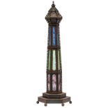 A late belle epoque wrought iron and colored glass lighthouse lamp, H 140 cm
