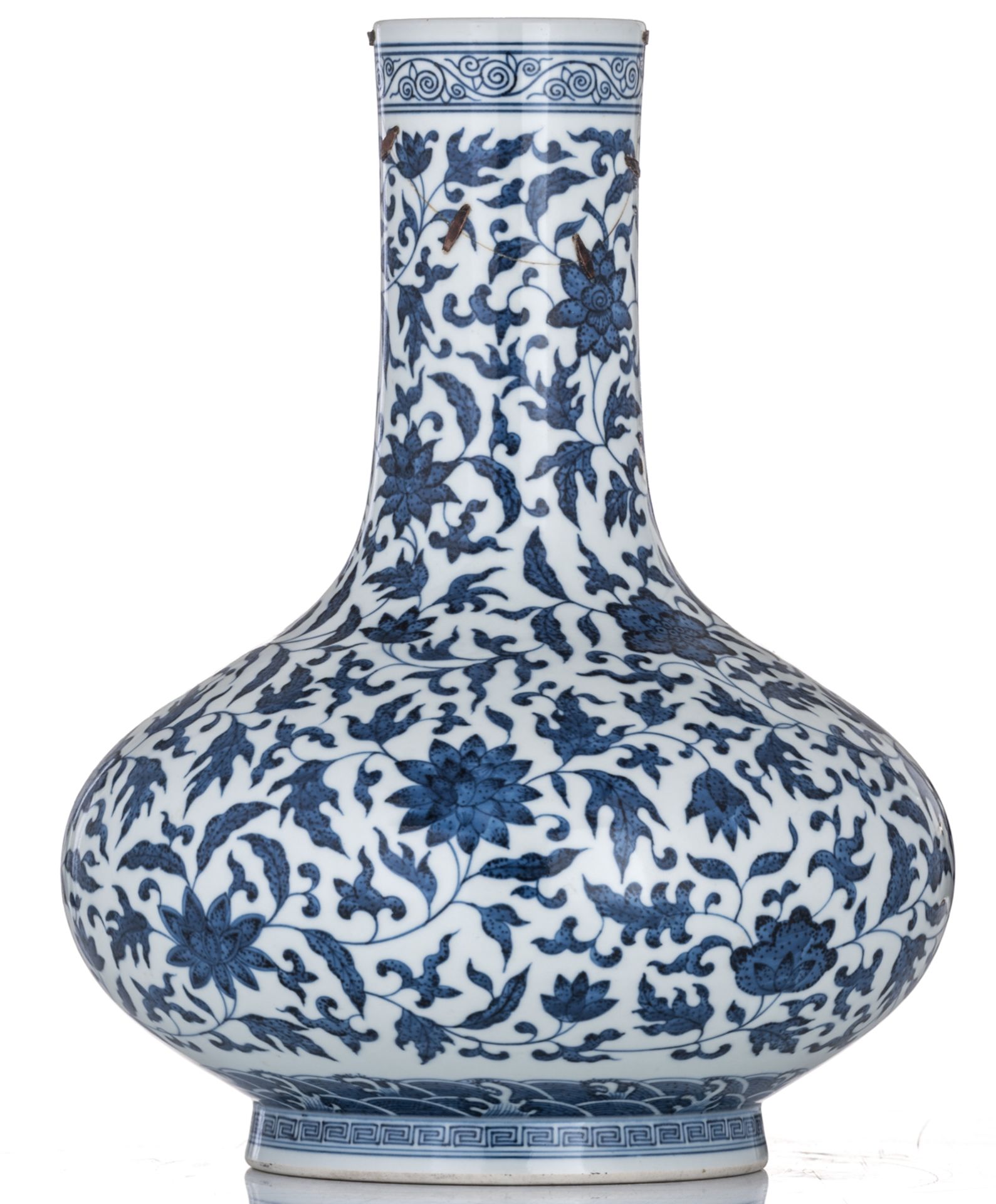 A Chinese blue and white bottle vase, decorated with scrolling leaves, with a Qianlong mark, 19thC, - Image 3 of 6