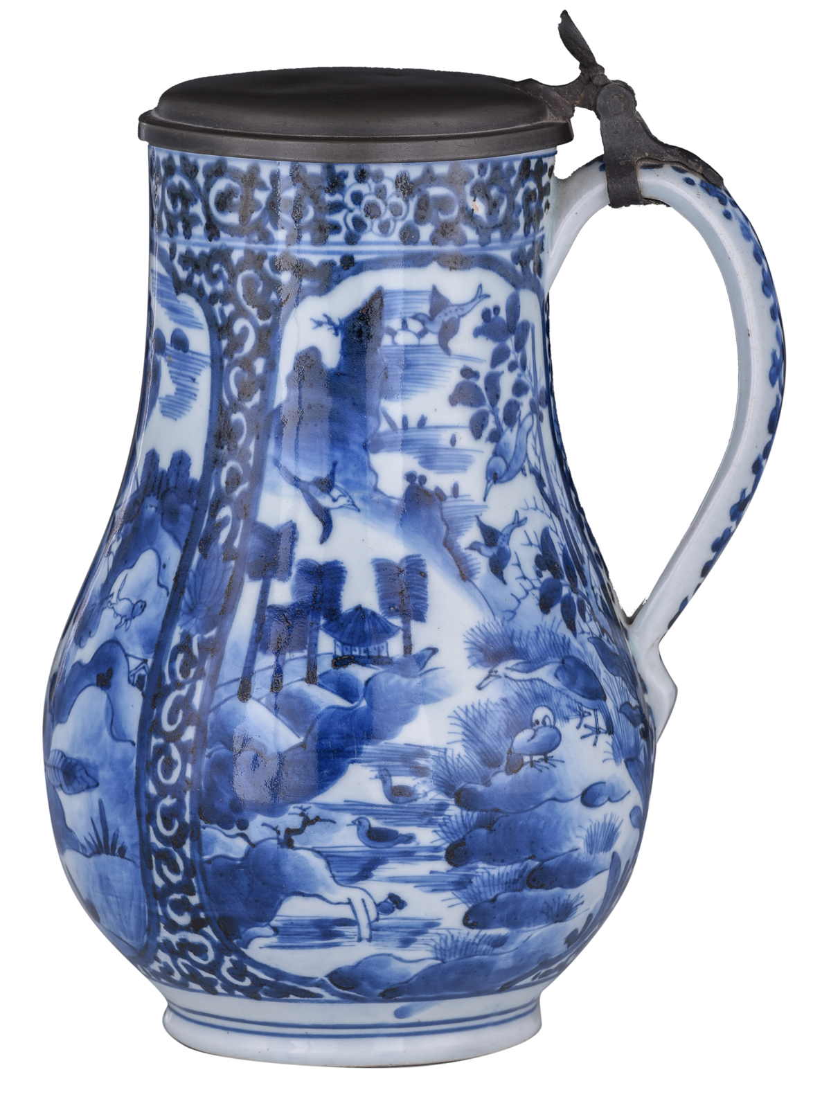 A Japanese Arita Imari blue and white tankard, decorated with scrollwork and panels, filled with fig