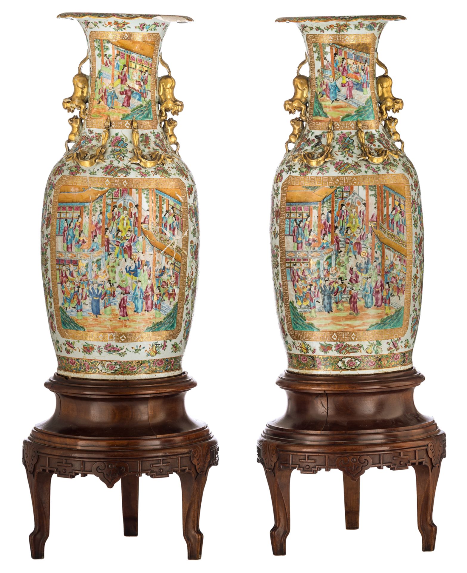 Two large Chinese famille rose floral and relief decorated Canton vases, the roundels with animated
