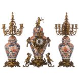 A Japanese Imari porcelain and French parcel bronze mounted three-piece clock garniture, 19thC, H 79
