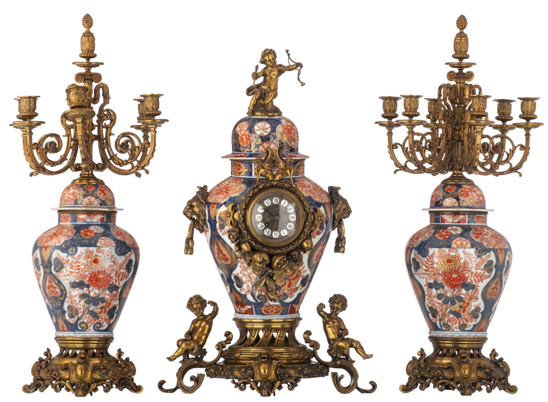 A Japanese Imari porcelain and French parcel bronze mounted three-piece clock garniture, 19thC, H 79