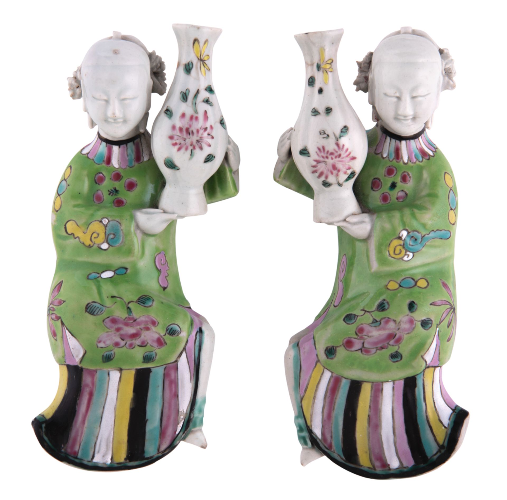 A pair of Chinese polychrome decorated porcelain figural wall vases, modelled as ladies holding a va