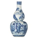 A Chinese blue and white double gourd vase, overall decorated with officials, their attendants and a