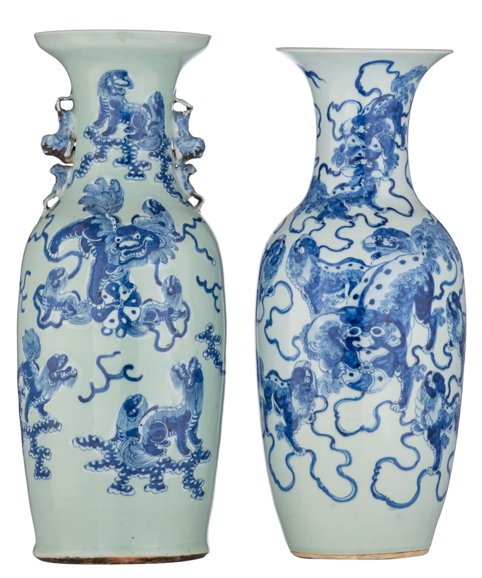 A Chinese celadon ground blue and white vase, decorated with Fu lions, 19thC; added a similar vase,