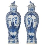 A pair of Chinese hexagonal porcelain vases and covers, blue and white decorated with figures in a p