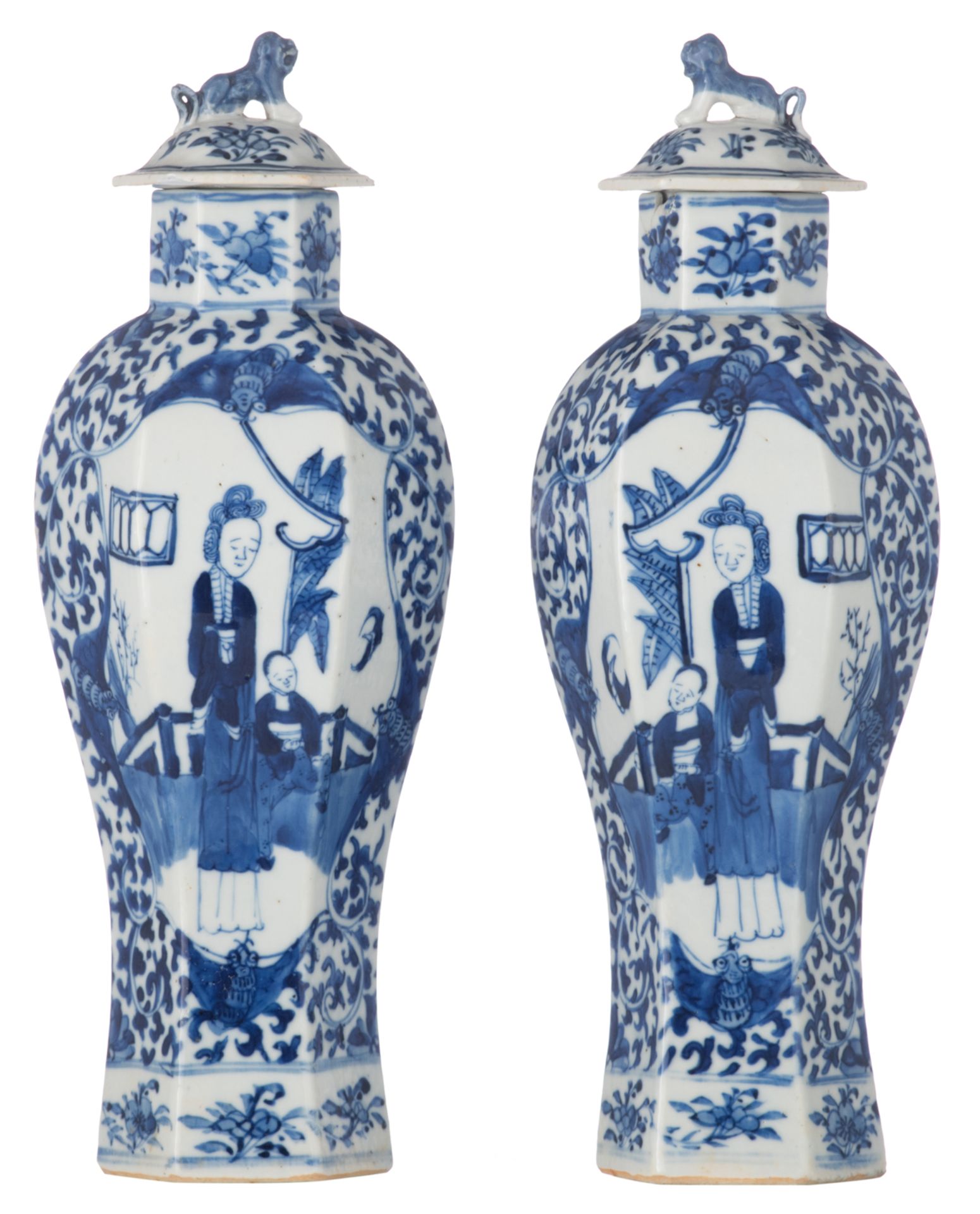 A pair of Chinese hexagonal porcelain vases and covers, blue and white decorated with figures in a p