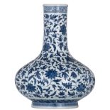A Chinese blue and white bottle vase, decorated with scrolling leaves, with a Qianlong mark, 19thC,