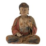 The Buddha, Shijiamuni (Sk. Sakyamuni), sits in meditation Lianhuazuo (Sk. Padmasana), with his hand