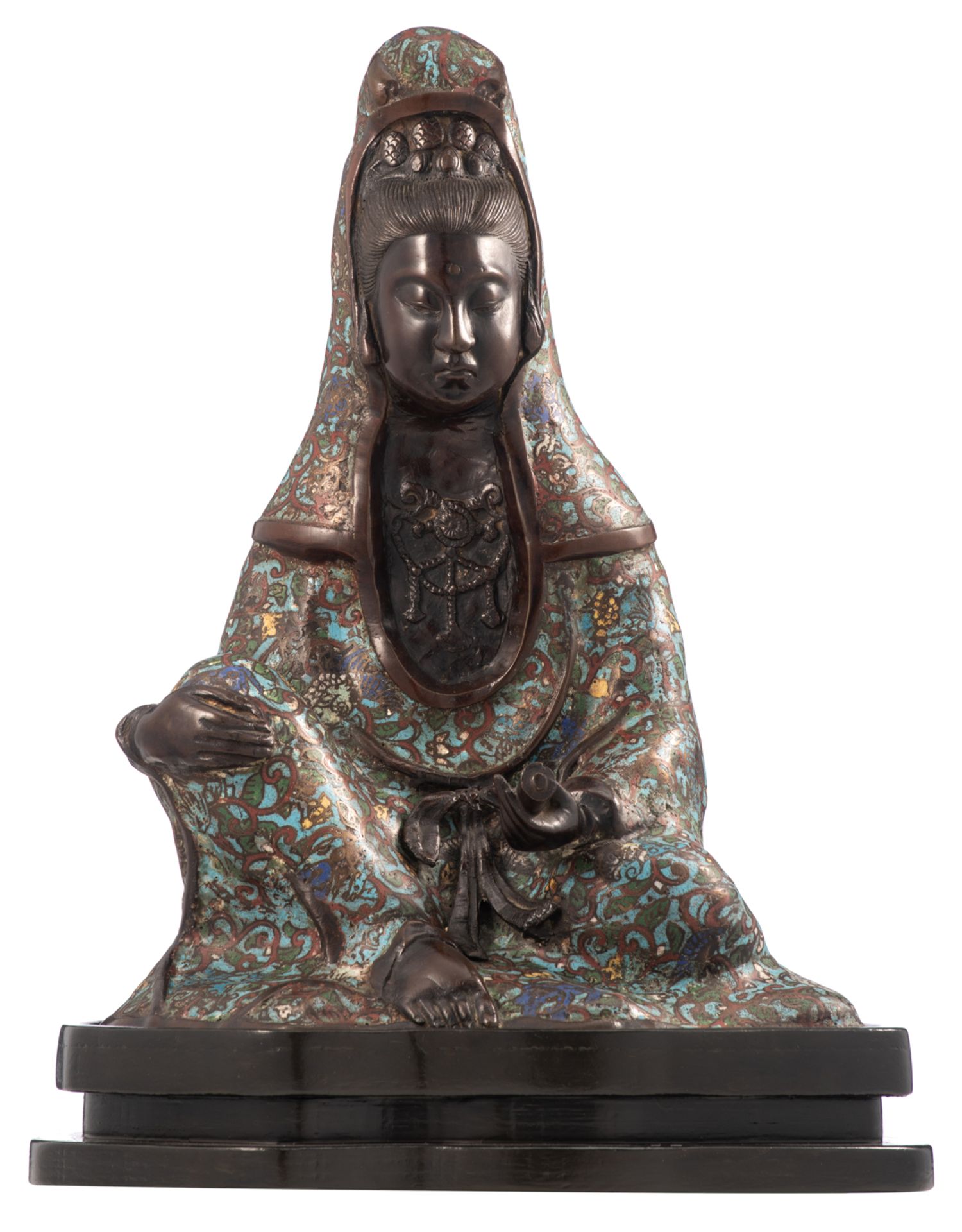 A Chinese seated Guanyin, champlevé enameled bronze, on a wooden base, about 1900, H 46 cm