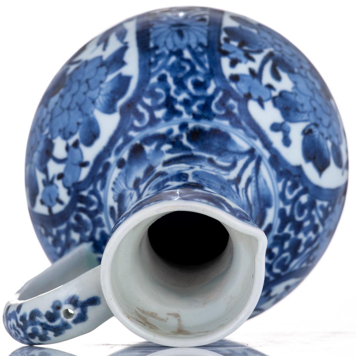 A Japanese last quarter of the 17thC Arita jug, with blue and white scrollwork all over, and roundel - Image 7 of 8