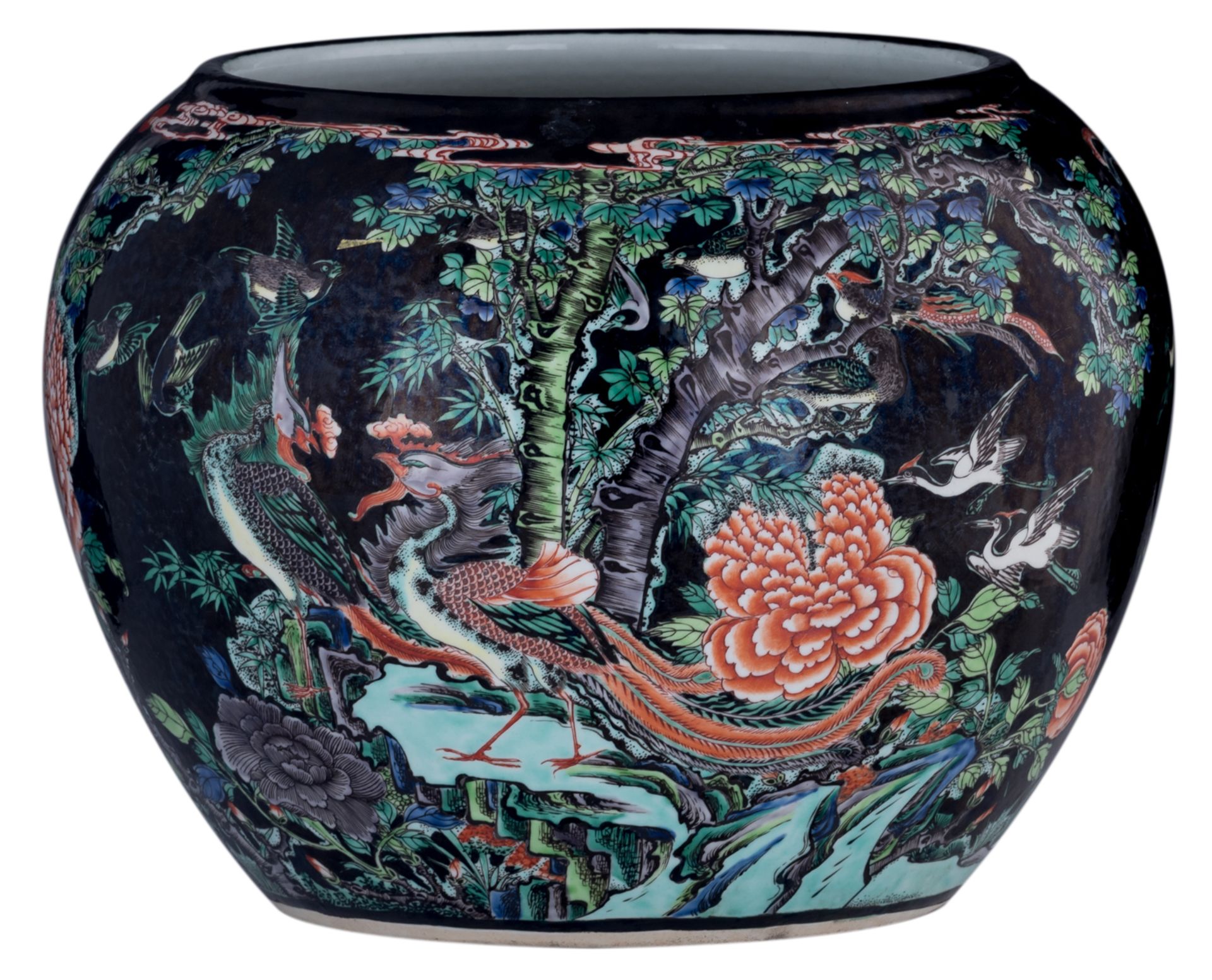 A Chinese black ground polychrome jardiniere, decorated with birds, flowers and a mythical bird, H 3