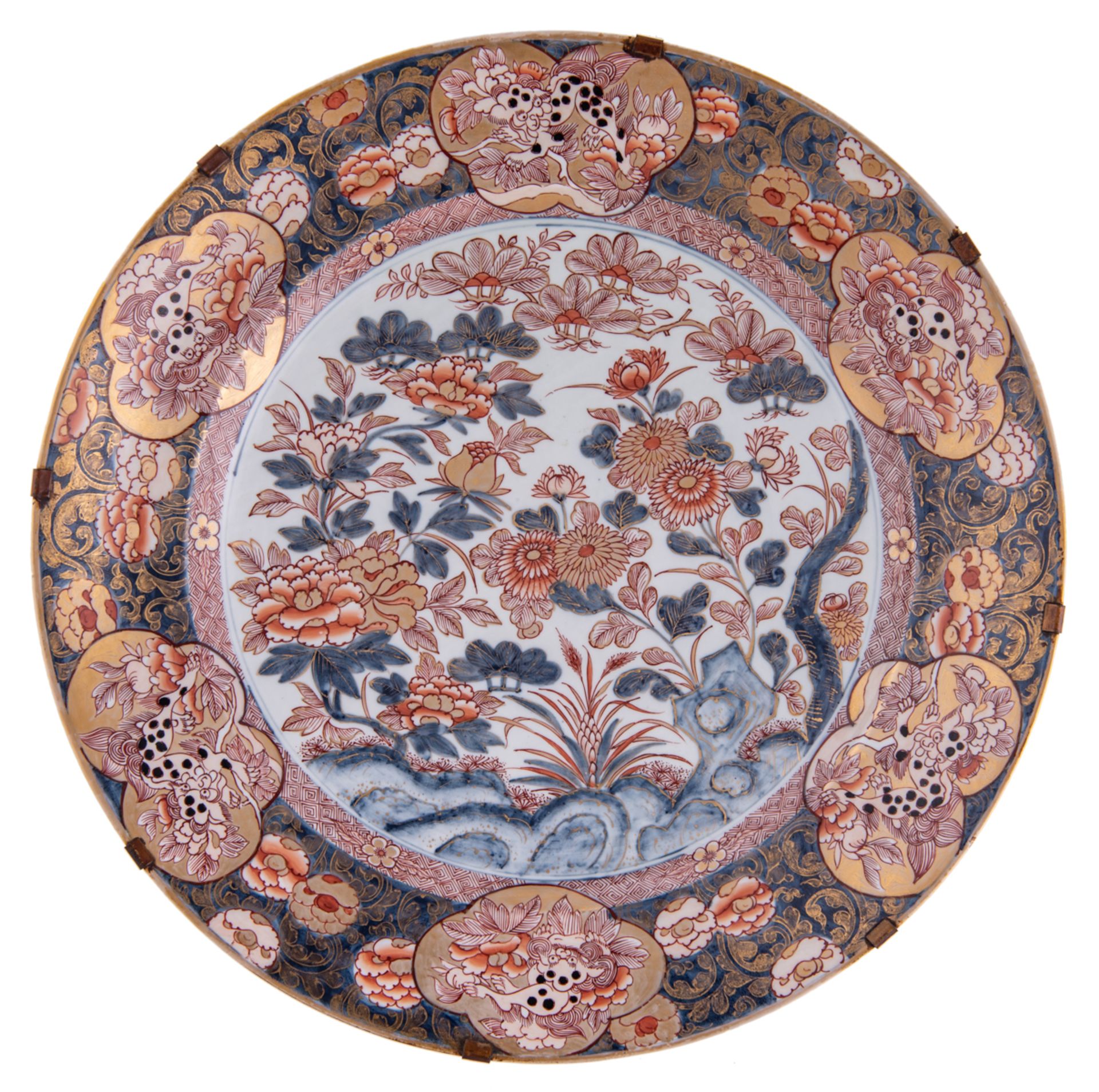 A large Edo period Japanese Imari plate, the central panel decorated with flowers, the roundels with