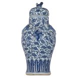 A Chinese blue and white and dragon relief decorated vase and cover, H 38,5 cm