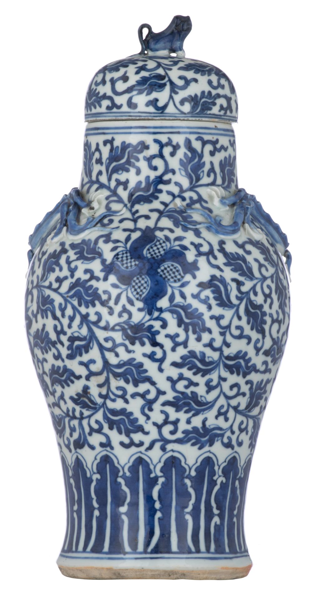 A Chinese blue and white and dragon relief decorated vase and cover, H 38,5 cm