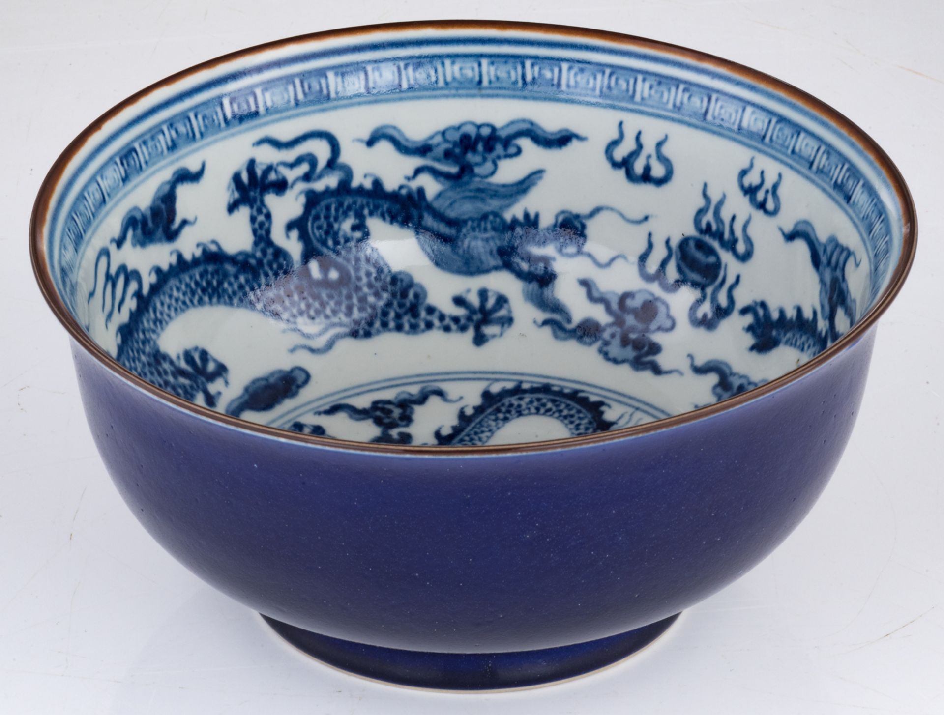A Chinese blue and white deep bowl, decorated with dragons chasing the pearl, with a Xuande mark, la - Image 8 of 8