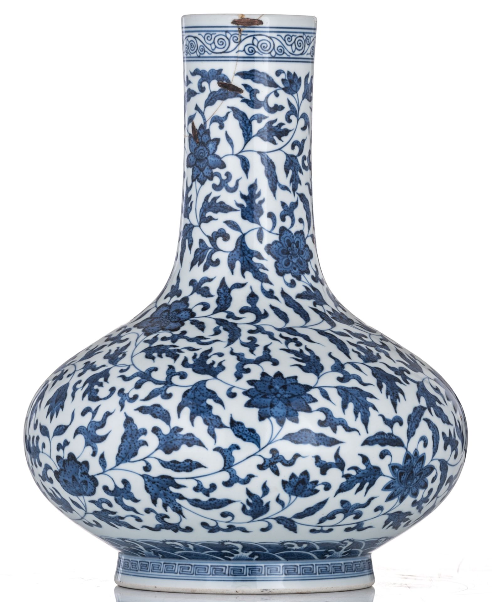 A Chinese blue and white bottle vase, decorated with scrolling leaves, with a Qianlong mark, 19thC, - Image 4 of 6