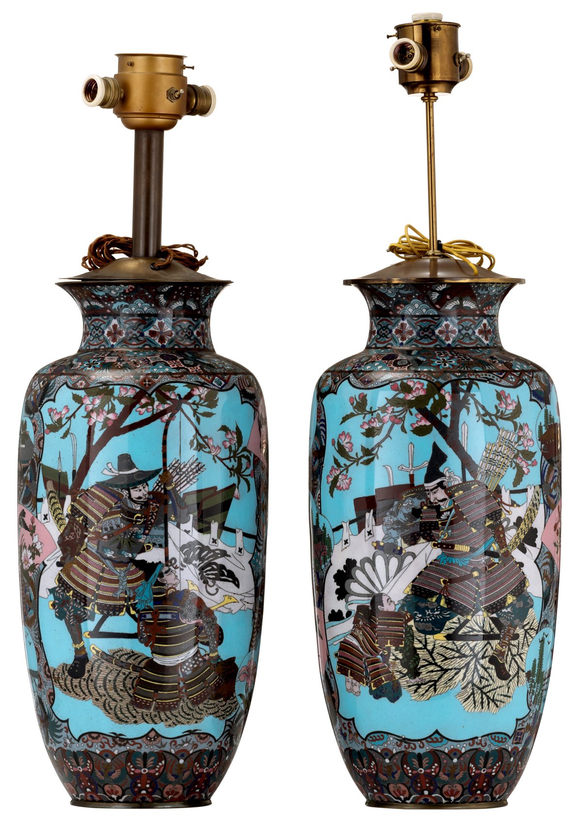 Two Japanese pale blue ground cloisonné enamel vases, the panels decorated with birds on flower bran