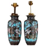 Two Japanese pale blue ground cloisonné enamel vases, the panels decorated with birds on flower bran