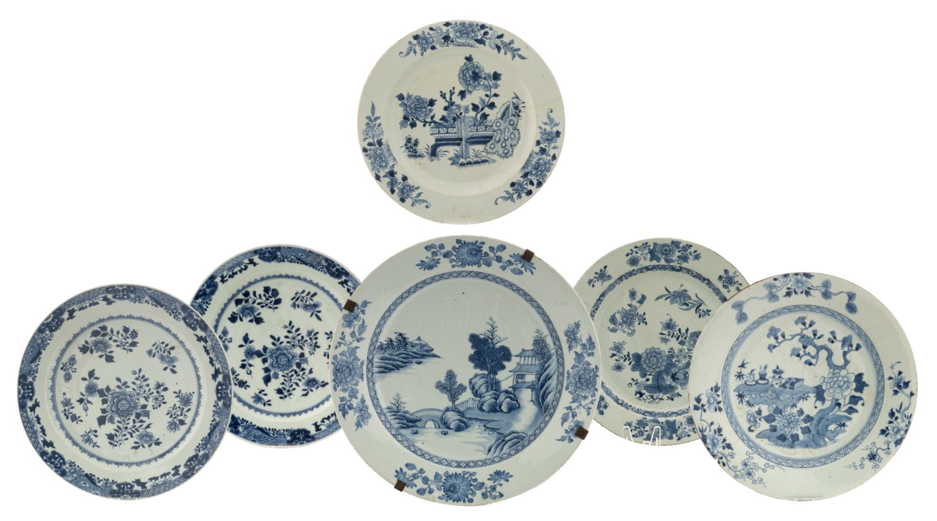 A lot of one pair and various large Chinese porcelain blue and white plates, decorated with a garden