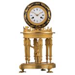 An exceptional gilt brass, bronze and enameld tin plate mantle clock, all around decorated with the