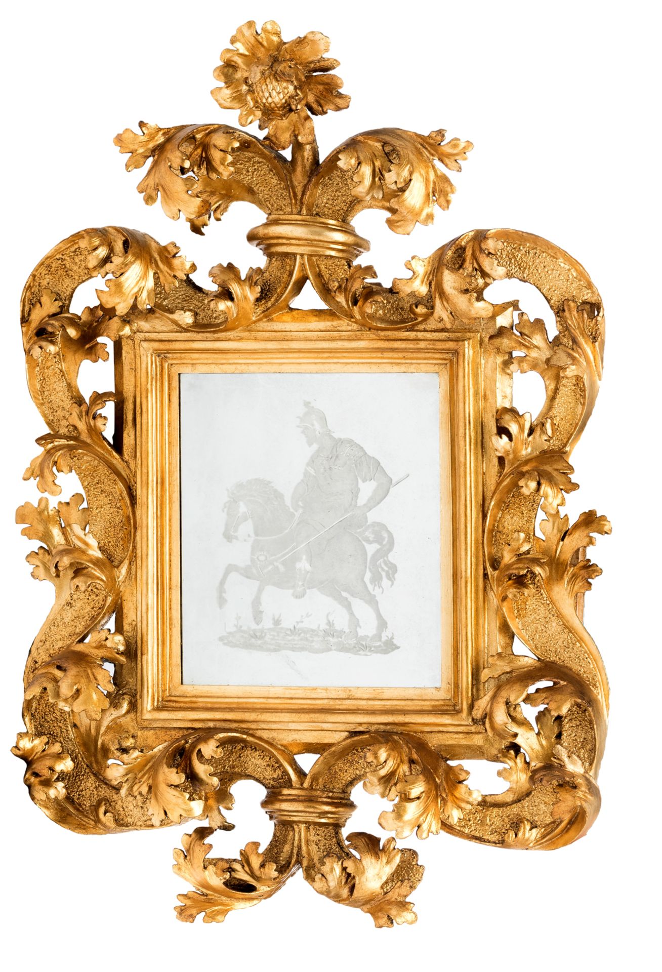 An impressive Italian Baroque mirror with a richly sculpted gilt wooden frame, the mirror with a cut
