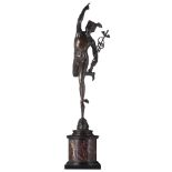 A patinated bronze Hermes statue after Giambologna, on a noir Belge and rouge Napoleon marble base,