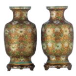 A pair of Chinese champlevé and cloisonné enamel vases, on matching patinated wooden stands, H 39 (w
