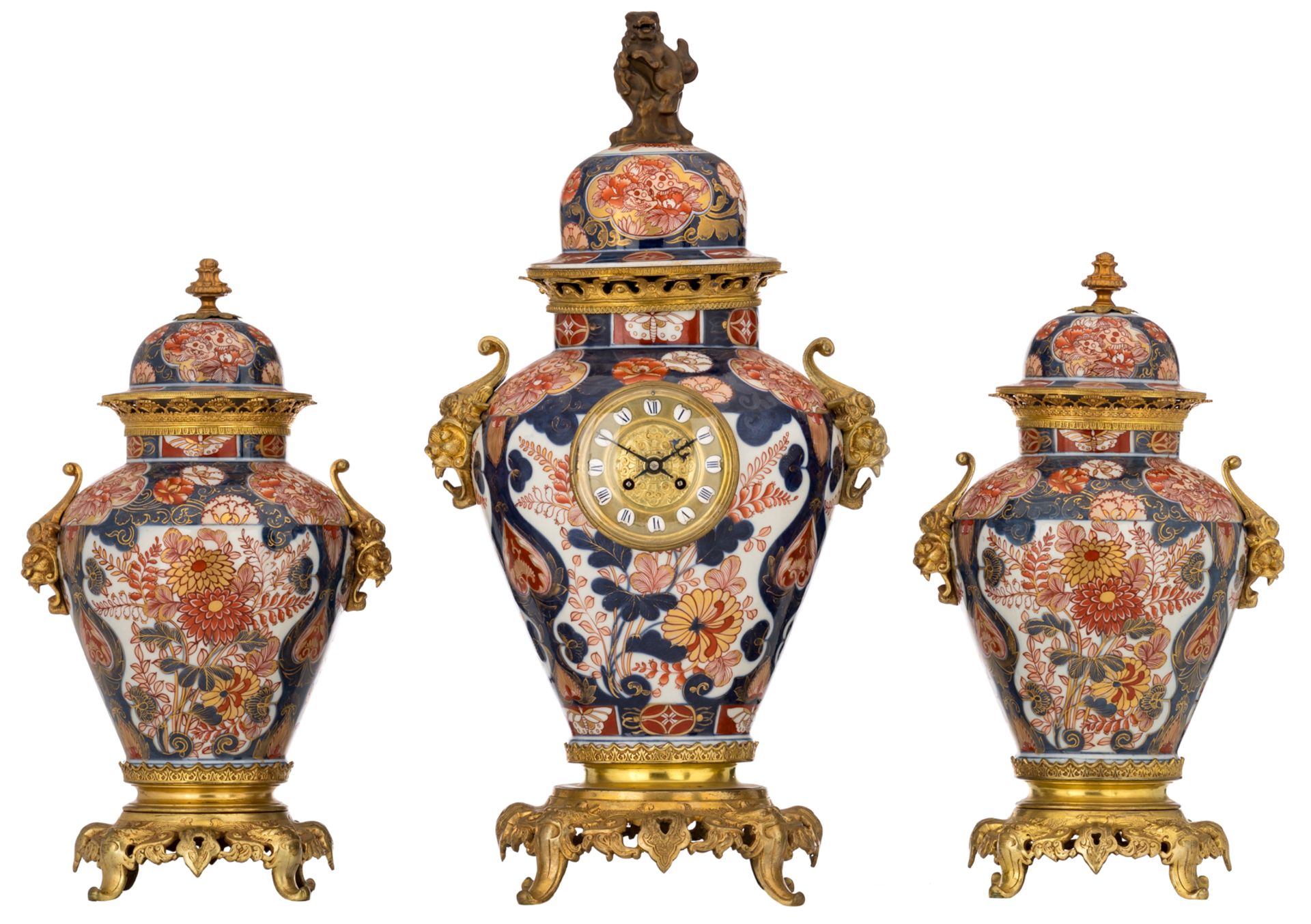 A Japanese Imari porcelain and French parcel gilt bronze mounted three-piece clock garniture, 19thC,