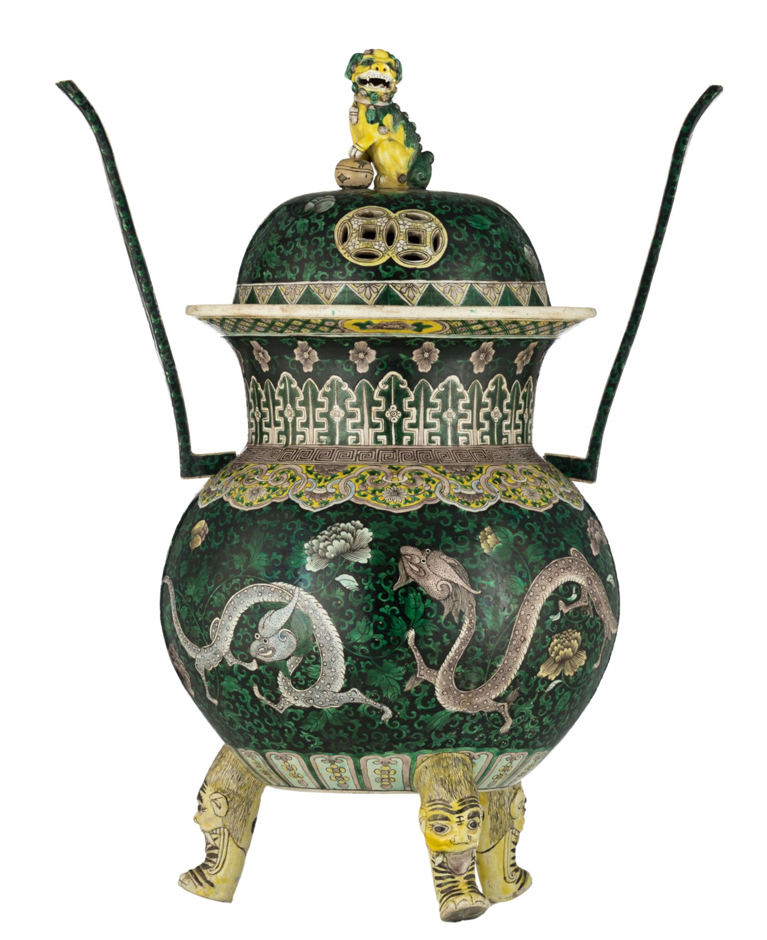 A Chinese tripod incense burner, famille verte decorated with dragons amongst undulating tendrils an