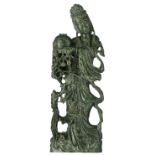 A Chinese carved spinach jade figure, depicting a lady holding a vase, H 70,5 cm