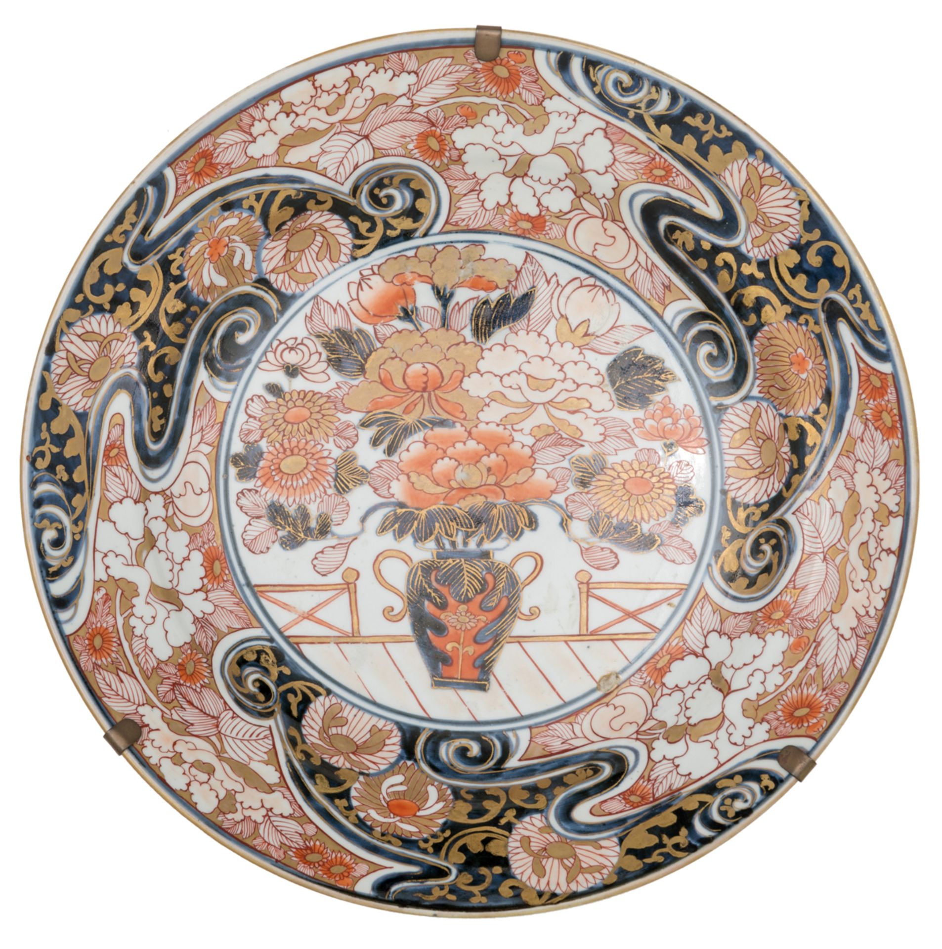 A large Japanese Arita Imari plate, the centre decorated with a flower basket, the border with a wav