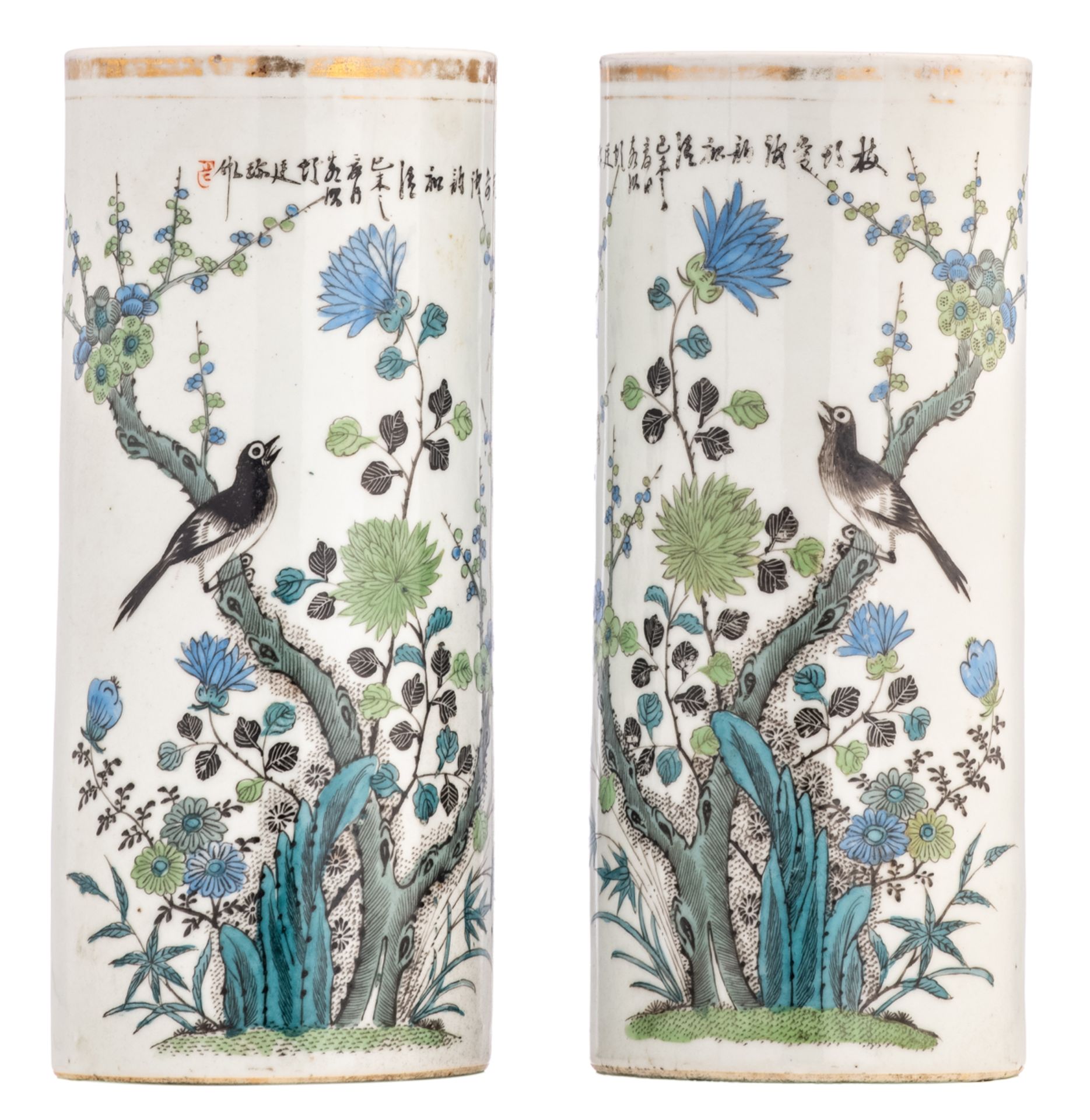 A pair of Chinese polychrome cylindrical vases, decorated with a rock, a bird and flower branches, m