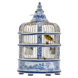 A 19thC Dutch blue and white birdcage with a stuffed goldfinch, (a similar birdcage was sold at