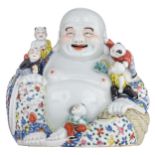 A Chinese polychrome seated Budai with children, with an impressed mark, H 26 cm