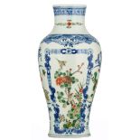 A Chinese blue and white baluster shaped vase, famille verte decorated with birds on flower