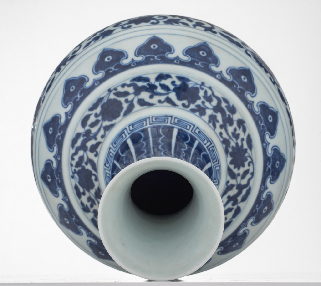 A Chinese blue and white bottle vase, decorated with the design of a meandering foliate scroll, with - Image 5 of 7