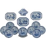 A series of twelve blue and white export porcelain tableware, decorated with a still life on a