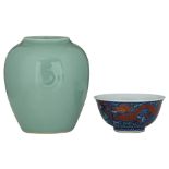 A Chinese monochrome celadon glazed vase, with a Qianlong Mark; added a blue ground wucai bowl,