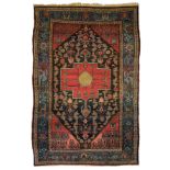An Oriental woollen rug, decorated with stylised motifs, 135 x 204 cm