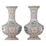 A pair of Chinese floral decorated Canton enamel vases, the roundels with birds and flower branches,