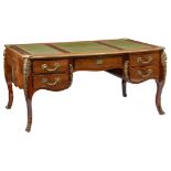 A French Louis XV style mahogany veneered bureau plat, with gilt bronze mounts and leather top