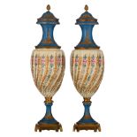 A pair of Sèvres covered vases with bleu céleste ground and polychrome decorated with polychrome and