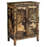 A Chinese polychrome lacquered cupboard, decorated with animated scenes on a terrace in a garden,