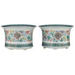 A pair of Chinese doucai cachepots, decorated with scrolling lotus, 19th/20thC, H 16,3 - 22,5 cm