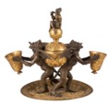 A French Renaissance Revival oil lamp decorated with devils and a monkey on top, gilt and