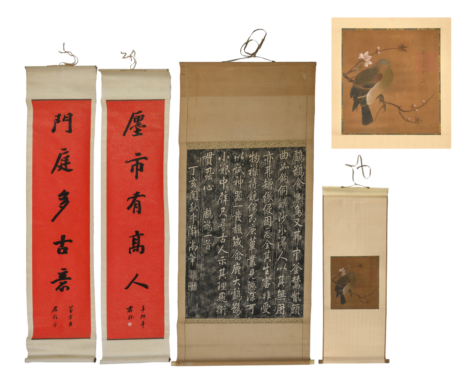 A Chinese ink and stone rubbing example of Emperor Qianlong's writing, with a bone scroll mount,