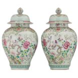 Two large Chinese famille rose floral decorated covered vases, the center with a bird couple on