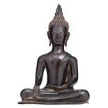 A South East Asian bronze seated Buddha with black lacquer patina, H 30,5 cm