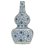 A large Chinese Ming type blue and white double gourd vase, the bulbs decorated with lotus